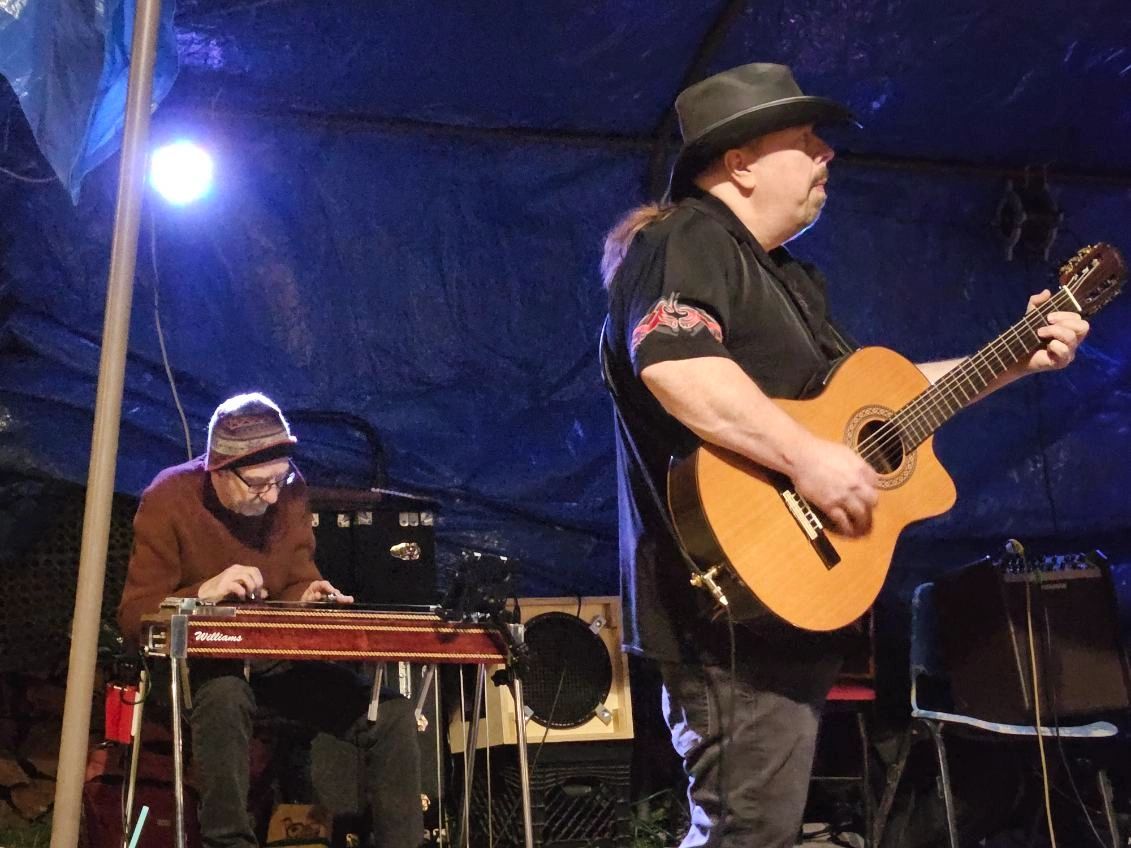 Live music performance with pedal steel guitar on stage